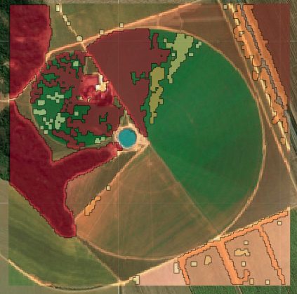 Satellite image of a property with a center pivot and flagged moisture-anomaly regions.